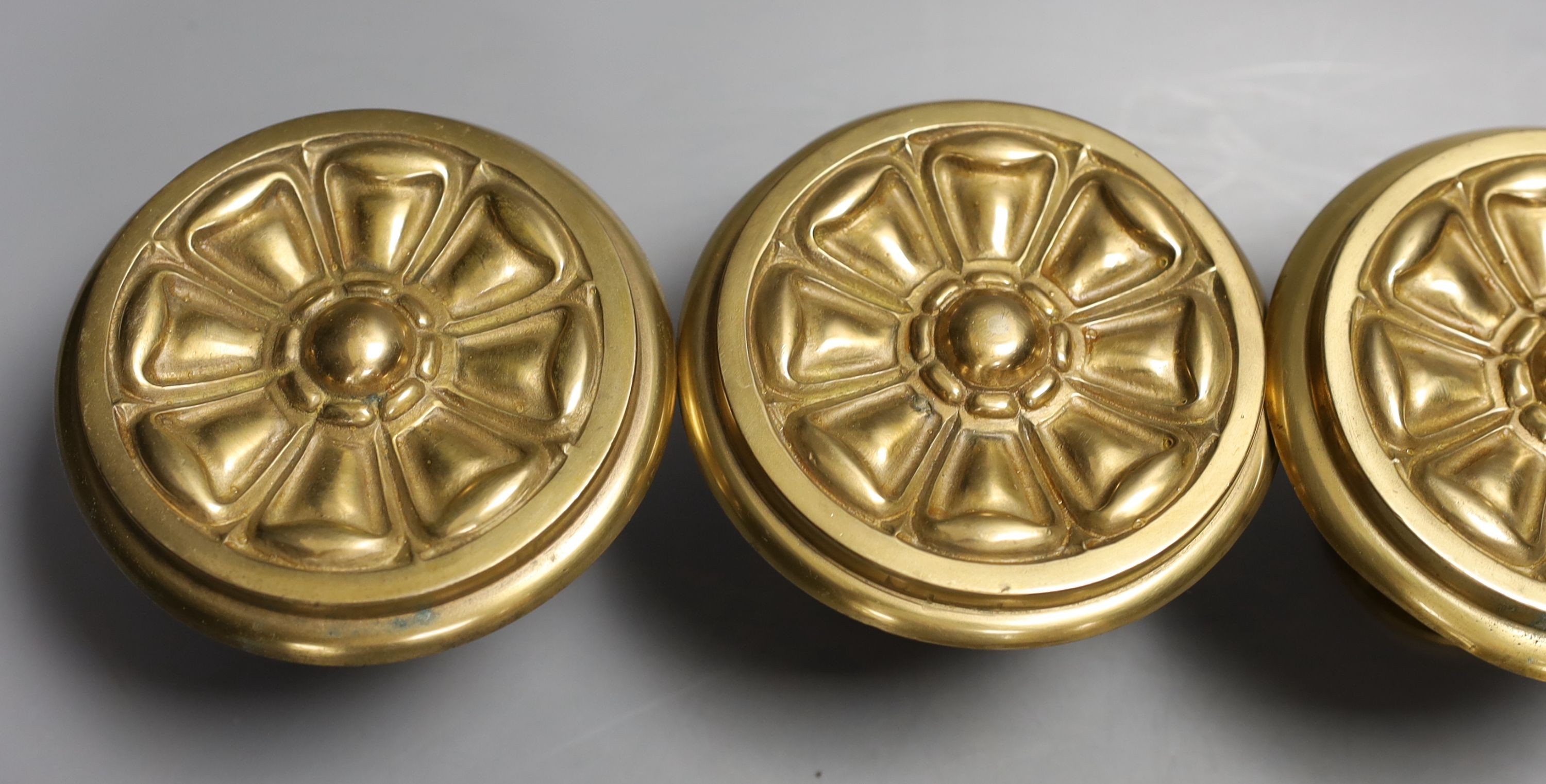 Four floral brass curtain tiebacks - 11cm diameter